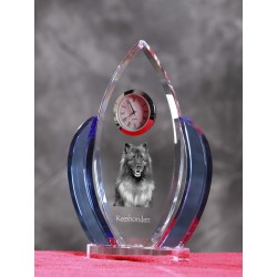 Keeshond- crystal clock in the shape of the wings with the image of a purebred dog.