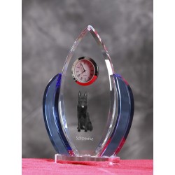 Schipperke- crystal clock in the shape of the wings with the image of a purebred dog.
